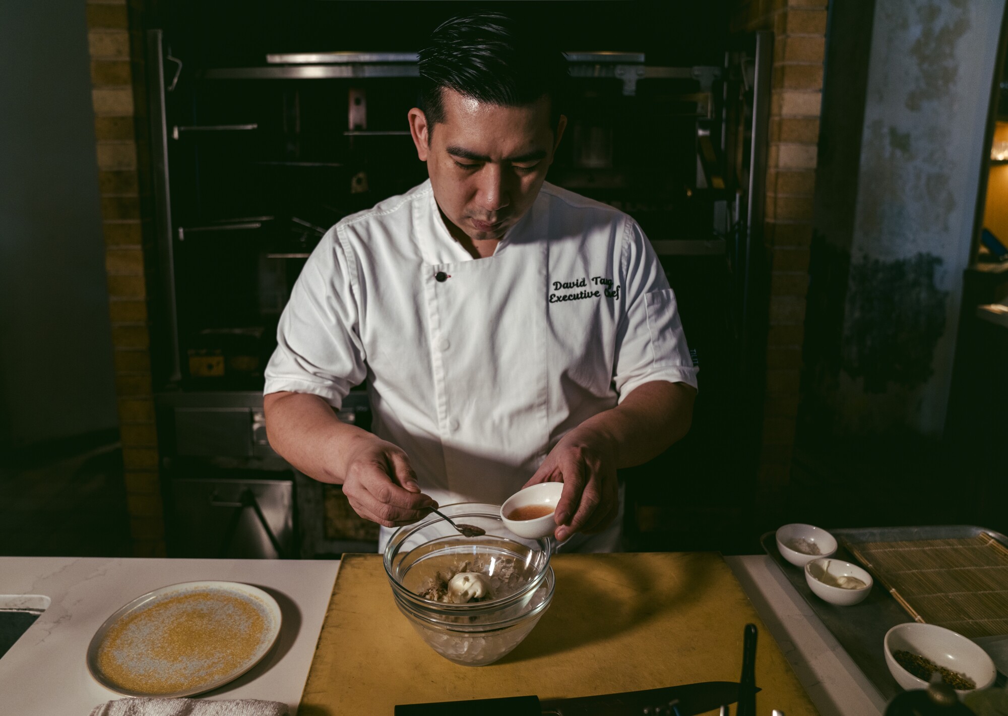 Chef David Tang prepares a dish 