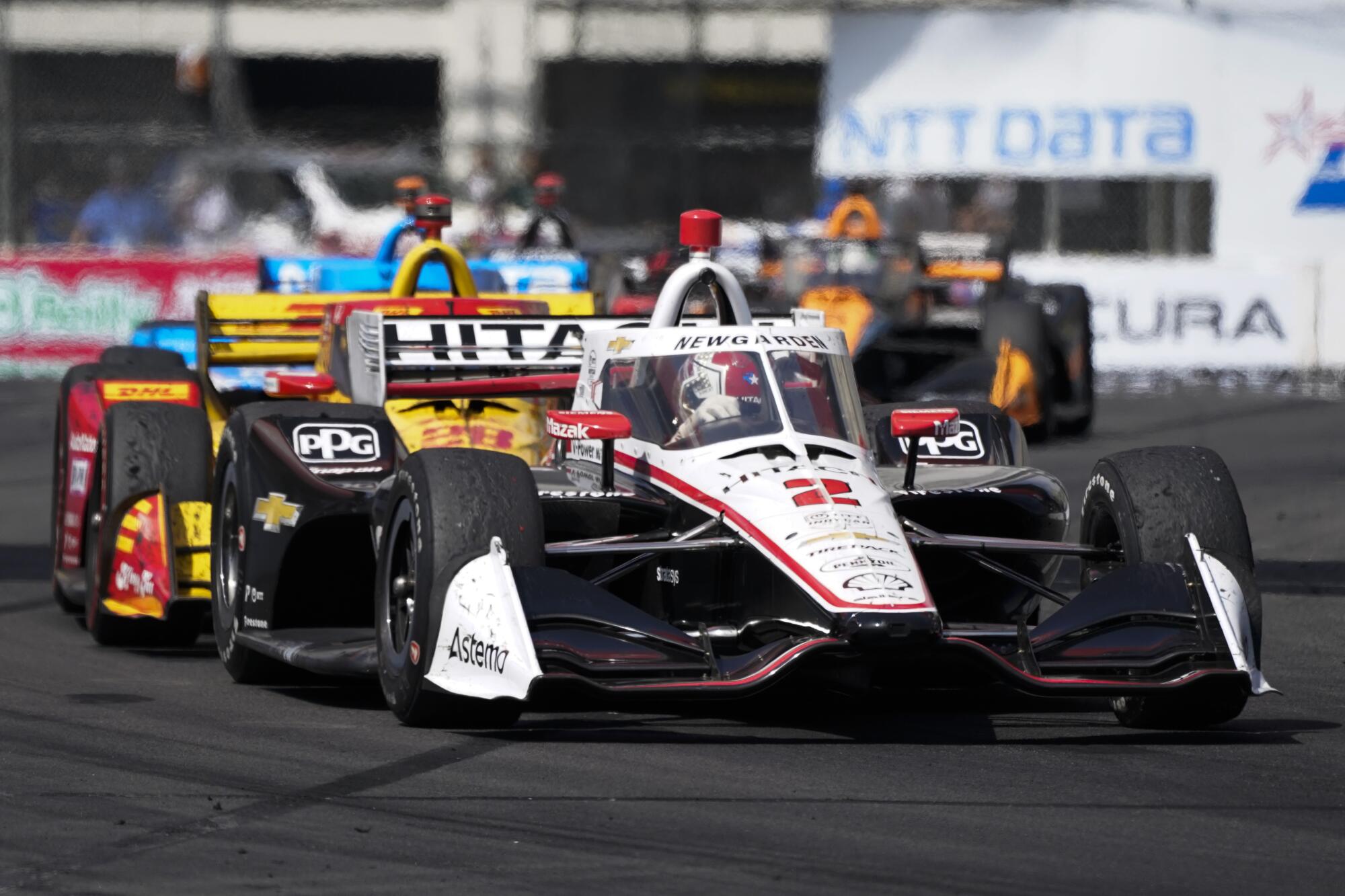 Team Penske driver Josef Newgarden (2) leads the pack en route to victory during the 2022 Grand Prix of Long Beach.