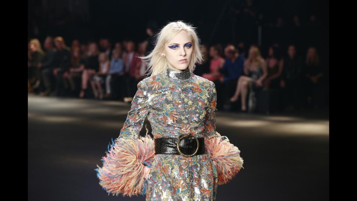 A model walks the runway at the Saint Laurent fashion show in Los Angeles.