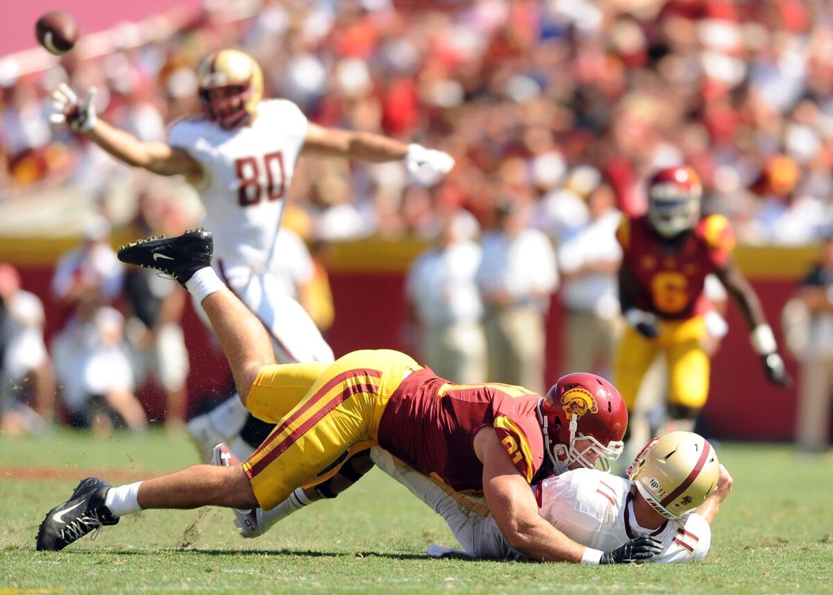 USC linebacker Morgan Breslin forces Boston College quarterback Chase Rettig to the turf during the Trojans' win on Sept. 14.