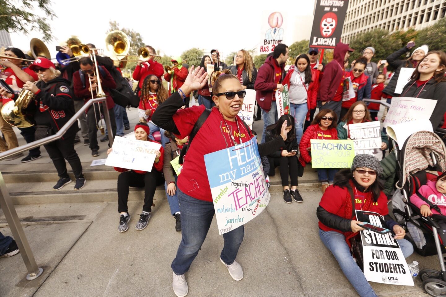 Kimberly Barrera, a 6th grade teacher, joins fellow teachers preparing for a rally in Grand Park in front of Los Angeles City Hall Friday.