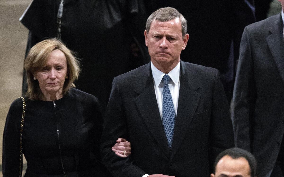 Supreme Court Chief Justice John Roberts and his wife Jane Sullivan Roberts depart the funeral for the late Supreme Court justice Antonin Scalia in Washington, D.C. on Feb. 20.