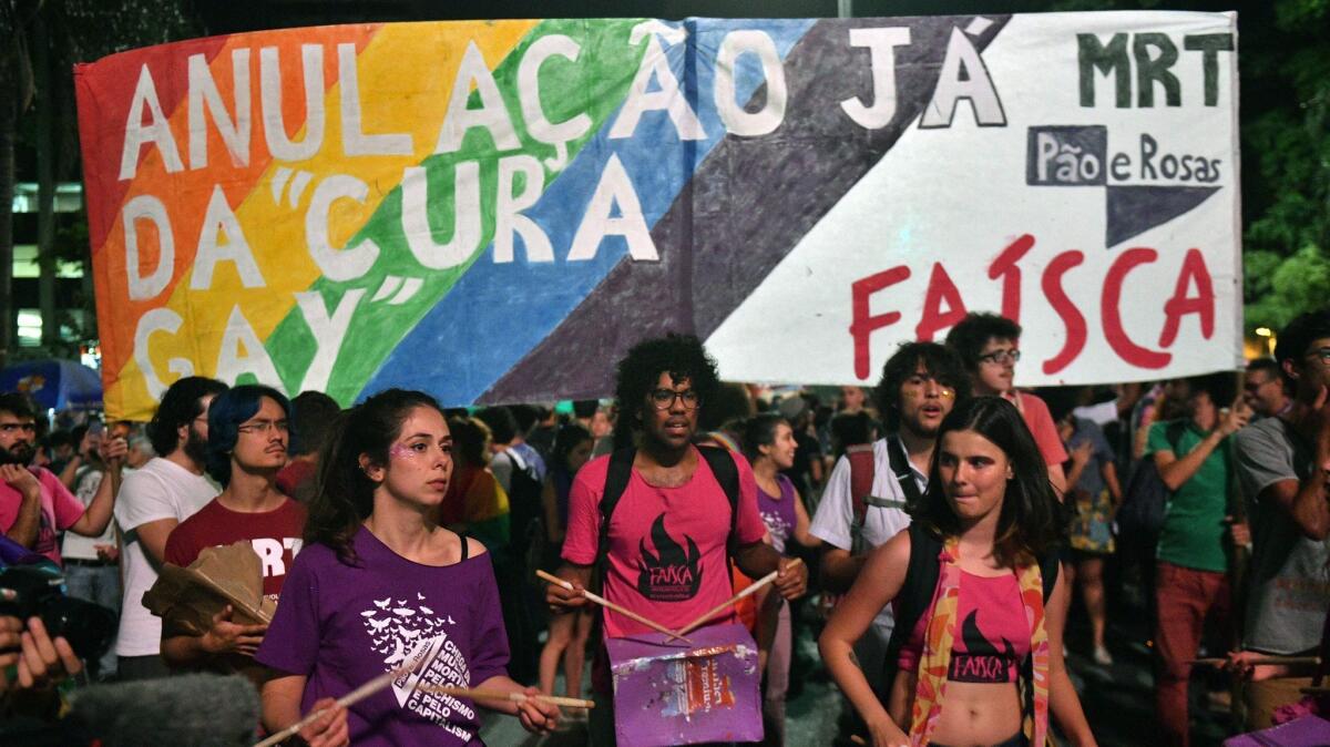 Protesters in Sao Paulo demonstrate against a Brazilian judge's decision to overturn a ban on gay conversion therapy.