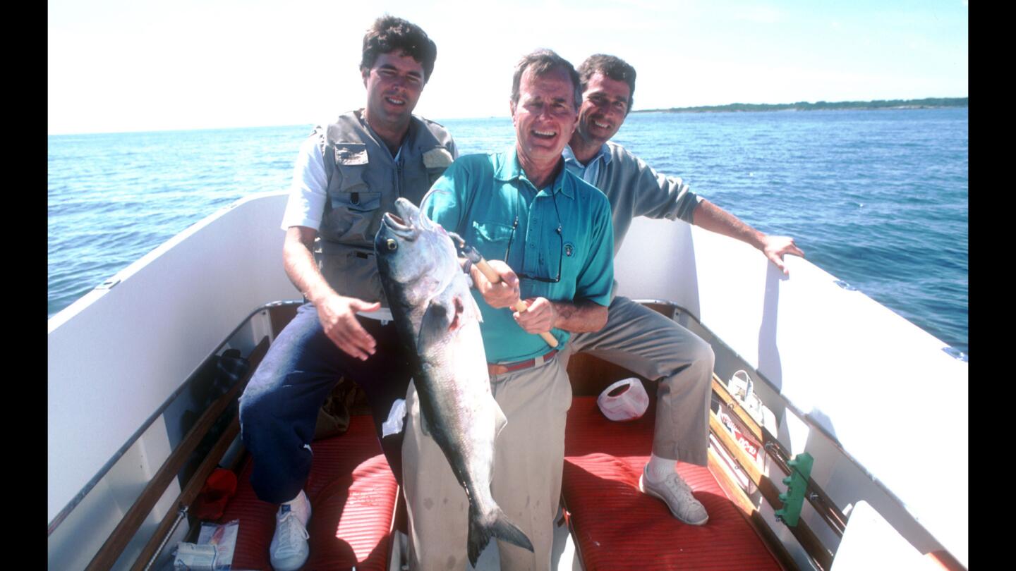 In 1983, Jeb and George W. Bush go fishing with their father, Vice President George H.W. Bush, in Maine.