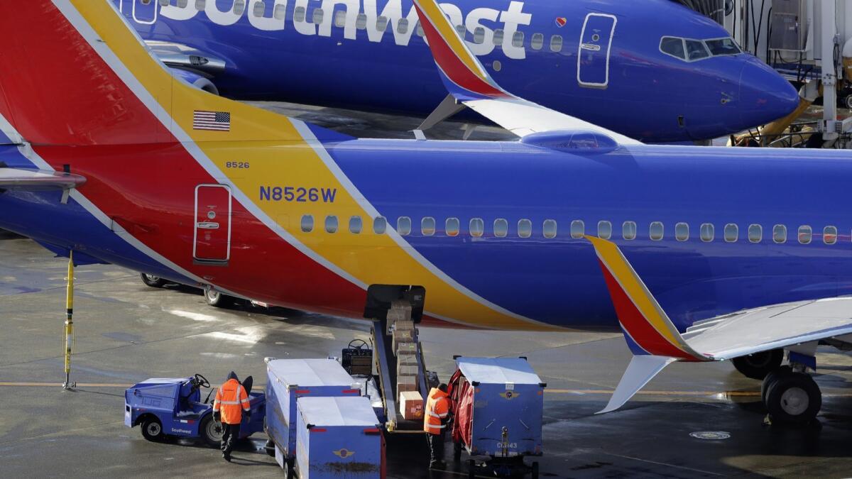 If you can't lift it, check it. Most airlines charge baggage fees to check. Southwest does not.