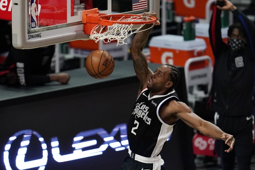 Los Angeles Clippers forward Kawhi Leonard (2) dunks against the Chicago Bulls during the second half of an NBA basketball game Sunday, Jan. 10, 2021, in Los Angeles. (AP Photo/Marcio Jose Sanchez)