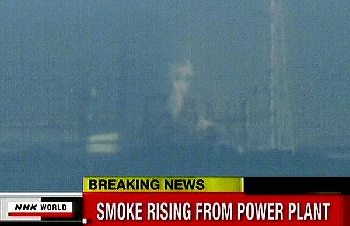 A screen grab from news footage shows white smoke rising from a new explosion at the Fukushima nuclear power station.