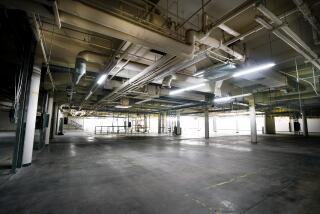 City personnel guide tour of a vacant commercial building in the Middletown neighborhood.