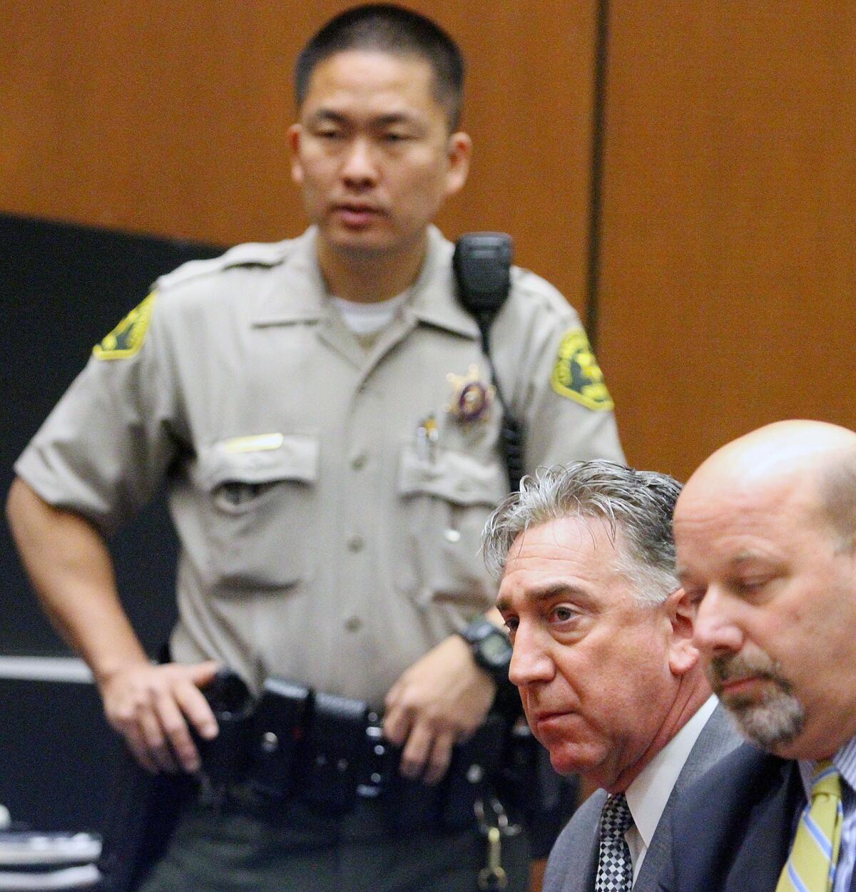 Former Glendale Mayor John Drayman at his sentencing at Superior Court, with his attorney Sean McDonald, in Los Angeles on Monday, April 7, 2014 for embezzling proceeds from the Montrose Farmer's Market, and filing false tax returns. His sentence is 365 days in county jail, with 4 days credit for time served, and to pay restitution and all court fees.