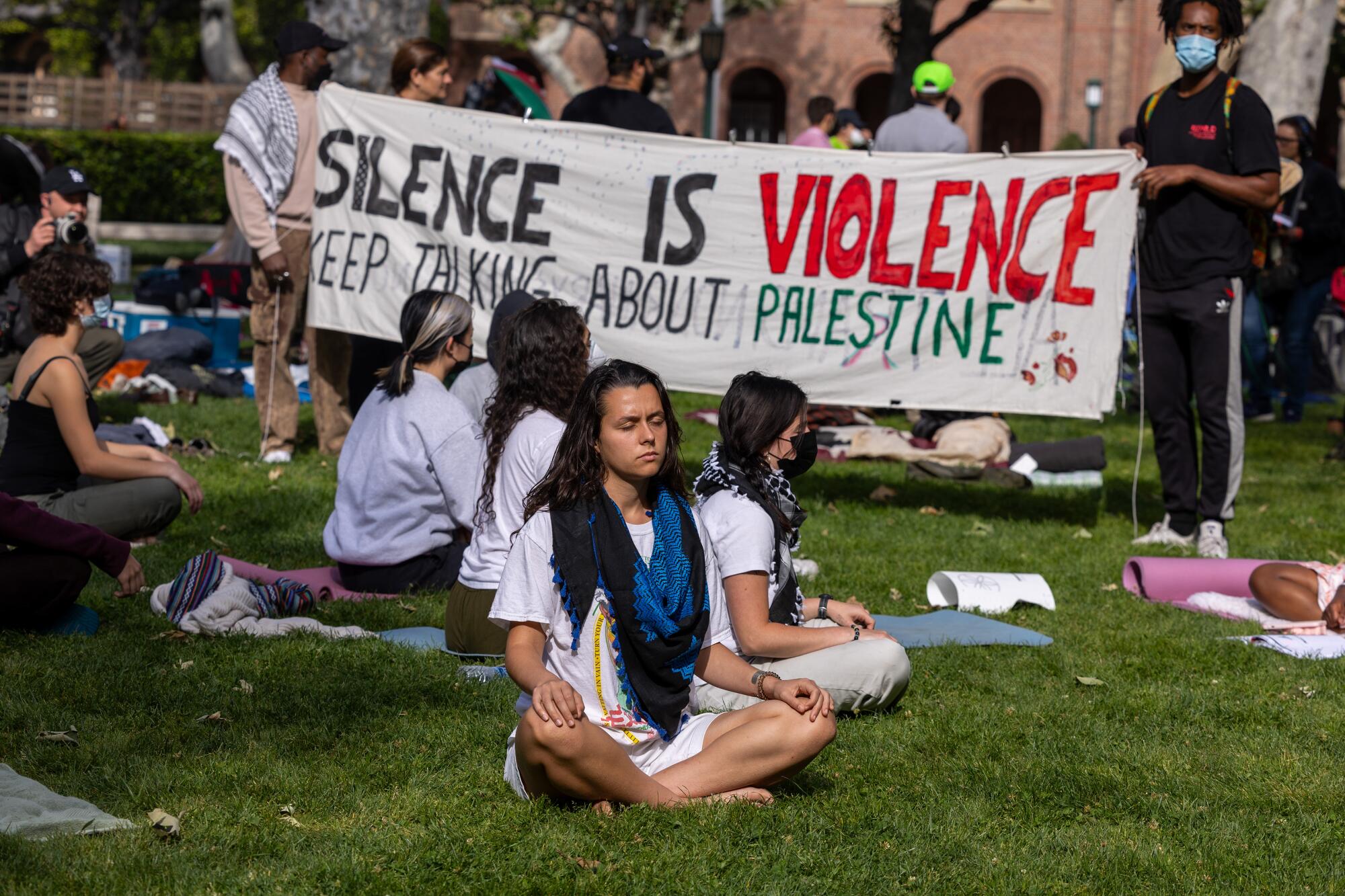 Pro-Palestinian demonstrators do yoga at at USC on April 24.