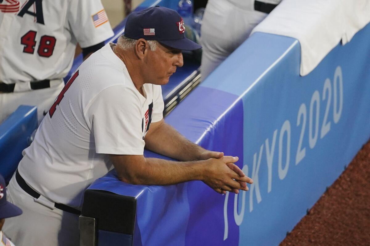 United States manager Mike Scioscia watches players warm up ahead of a semi-final baseball game against South Korea at the 2020 Summer Olympics, Thursday, Aug. 5, 2021, in Yokohama, Japan. (AP Photo/Sue Ogrocki)