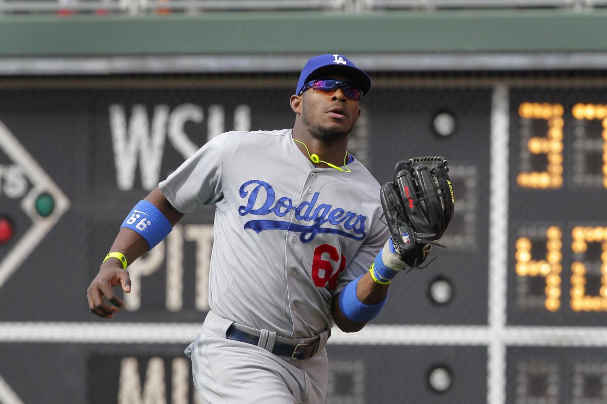 Dodgers outfielder Yasiel Puig catches a fly ball during a game against the Philadelphia Phillies at Citizens Bank Park on May 24.
