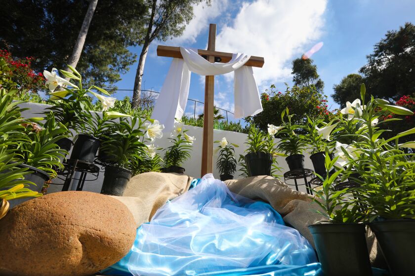 A resurrection cross display is outside the entrance of the St. Francis Chapel at Mission San Diego Alcalá, in preparation for the Easter Vigil Mass, to be held Saturday night.