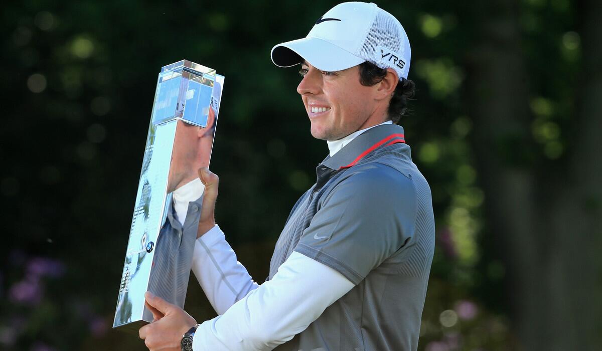 Rory McIlroy poses with the trophy following his victory at the BMW PGA Championship on Sunday.