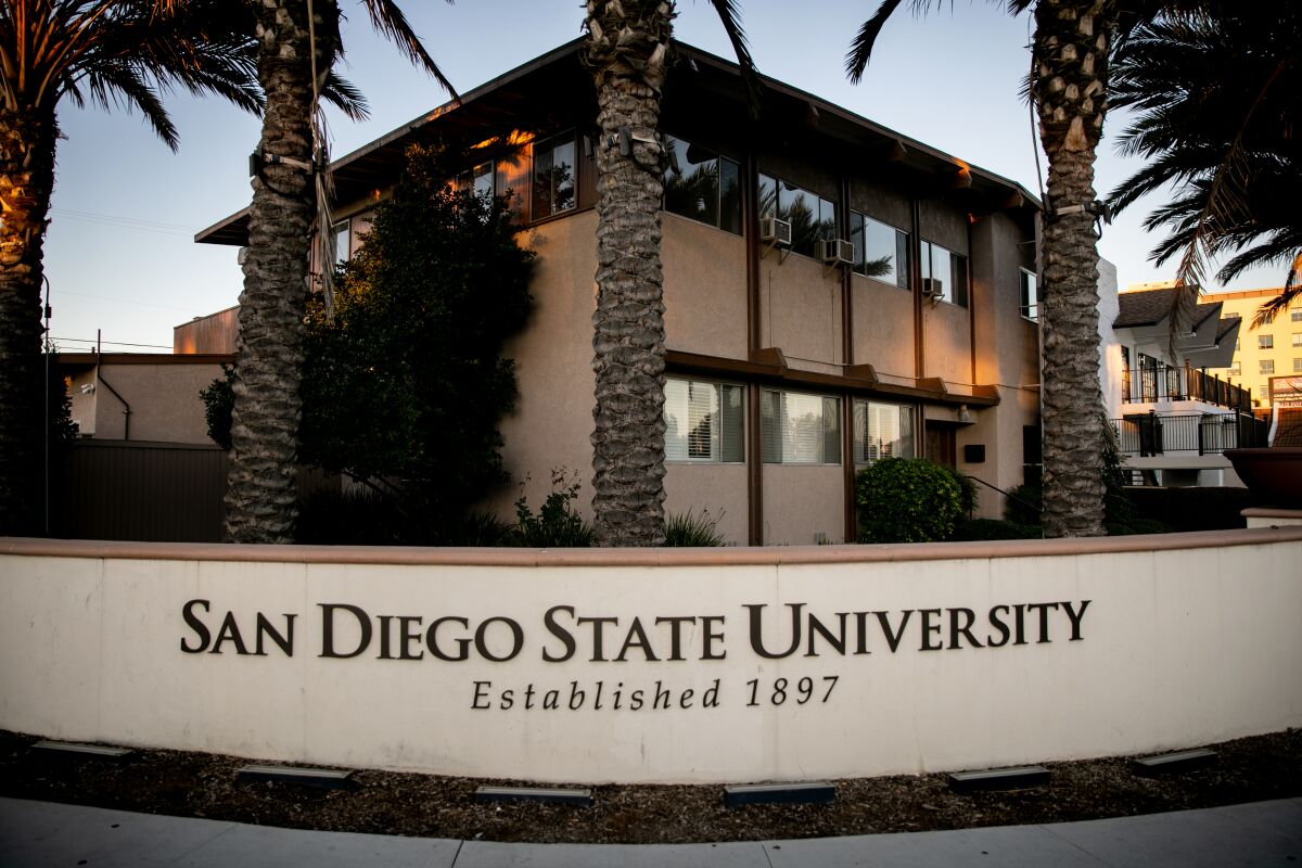 A sign for San Diego State University in front of the former Phi Gamma Delta fraternity house.
