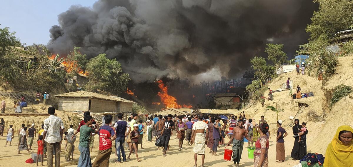Smoke rises following a fire at the Rohingya refugee camp.