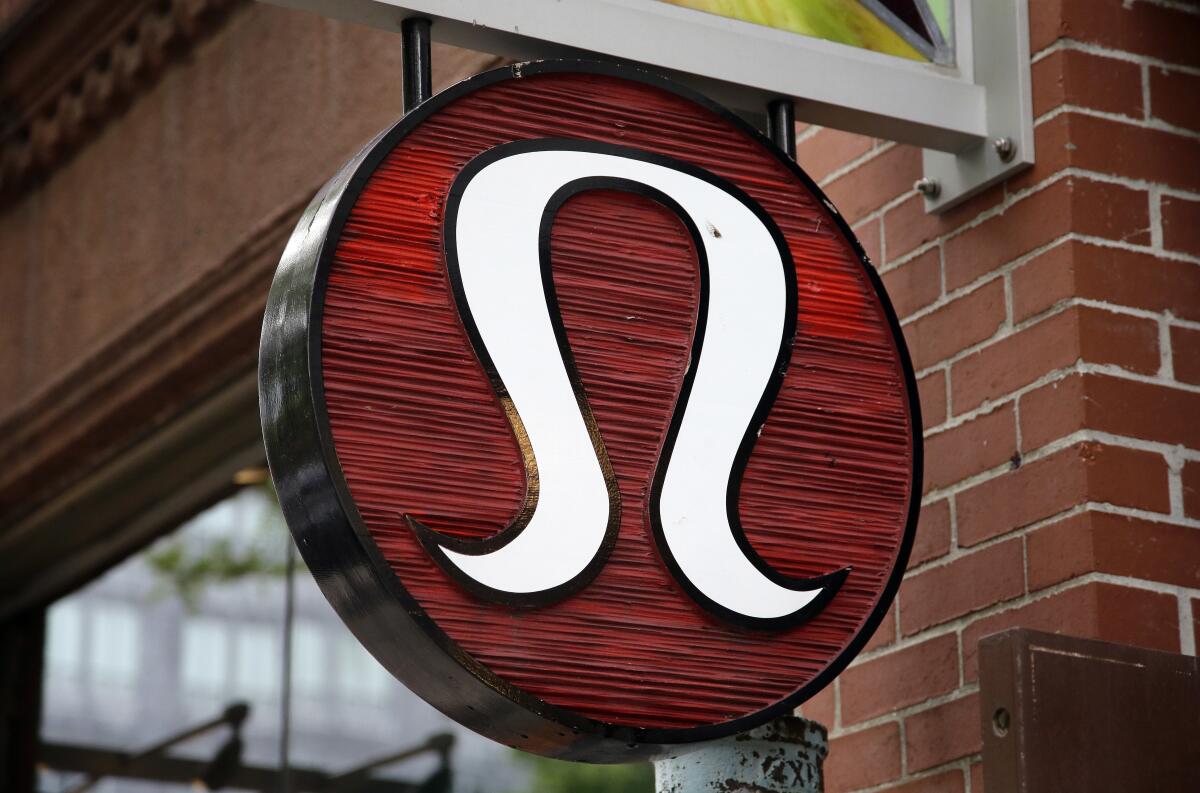 FILE - This June 5, 2017, file photo, shows a Lululemon Athletica logo outside a store on Newbury Street in Boston. Lululemon workers in Washington, D.C. have filed for a union election, joining the ranks of workers at other major companies pushing to organize their facilities. The petition was filed Wednesday, July 20, 2022, by a group that calls itself the Association of Concerted Educators. (AP Photo/Steven Senne, File)