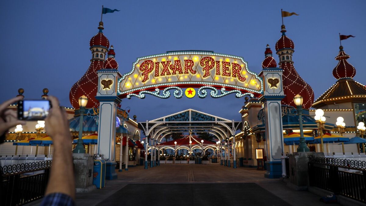 The entrance to Pixar Pier at night.