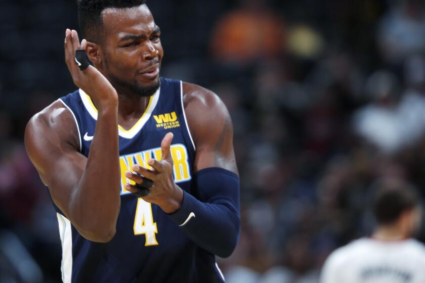 Denver Nuggets forward Paul Millsap gestures to referees to call a shooting foul, after he hit a basket against the Miami Heat during the first half of an NBA basketball game Friday, Nov. 3, 2017, in Denver. (AP Photo/David Zalubowski)