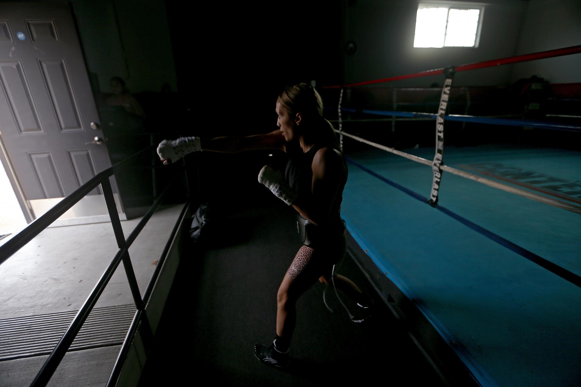Seniesa Estrada shadow boxes before a sparring session at a nondescript gym in Bell Gardens.