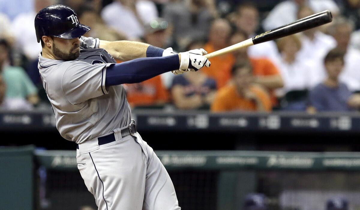Tampa Bay Rays' Curt Casali hits a solo home run against the Houston Astros during the fifth inning of a game on Aug. 18.