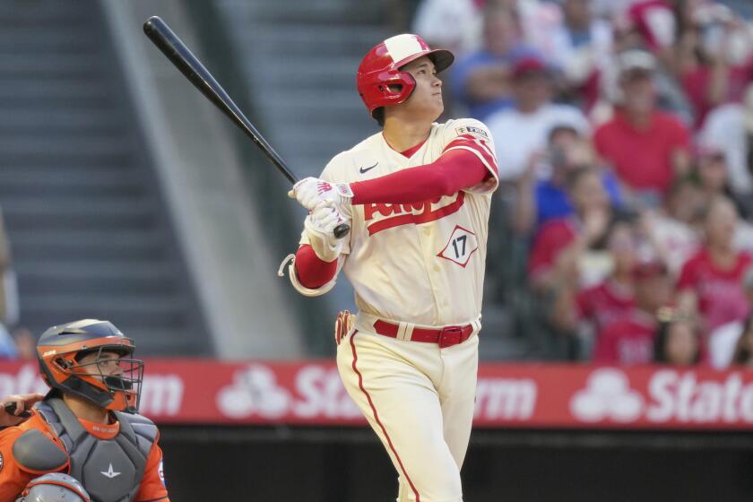 Los Angeles Angels designated hitter Shohei Ohtani hits a home run during the ninth inning.