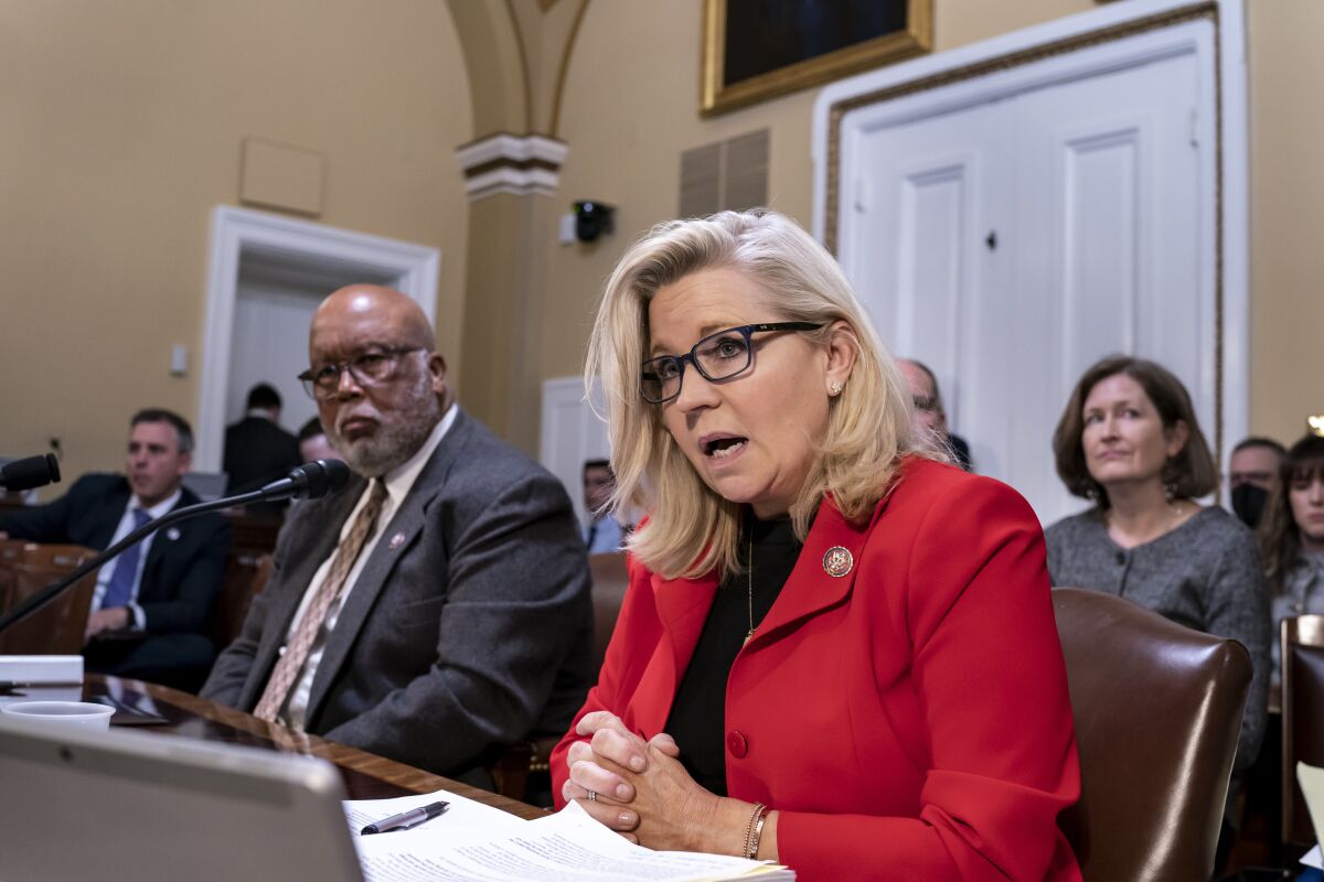 FILE - Rep. Liz Cheney, R-Wyo., vice chair of the House Select Committee investigating the Jan. 6 U.S. Capitol insurrection, joined at left by Chairman Bennie Thompson, D-Miss., testifies before the House Rules Committee seeking contempt of Congress charges against former Trump advisers Peter Navarro and Dan Scavino in response to their refusal to comply with subpoenas, at the Capitol in Washington, Monday, April 4, 2022. (AP Photo/J. Scott Applewhite, File)