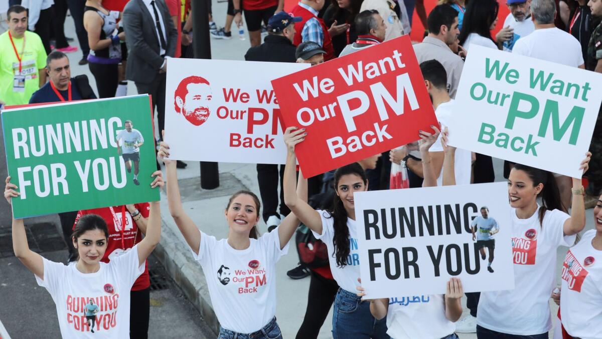 At the starting line of Beirut’s annual marathon on Nov. 12, 2017, supporters of former Lebanese Prime Minister Saad Hariri rally to call for his return from Saudi Arabia.