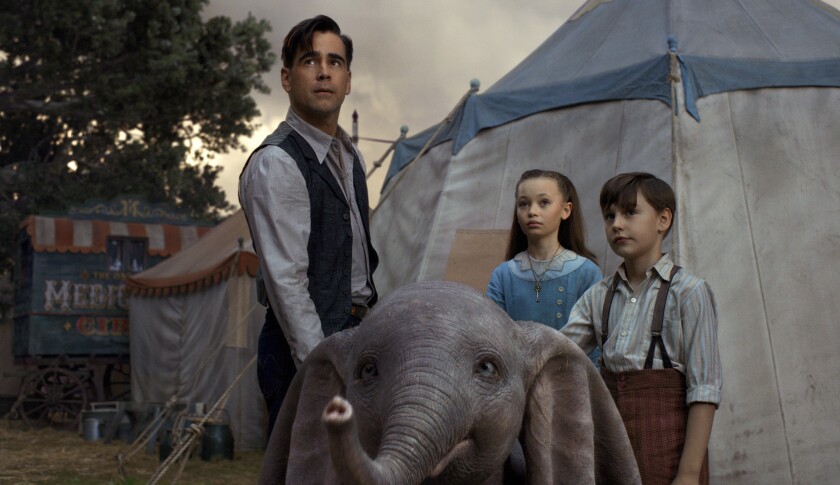 Colin Farrell, Nico Parker and Finley Hobbins in a scene from the "Dumbo" live-action remake.