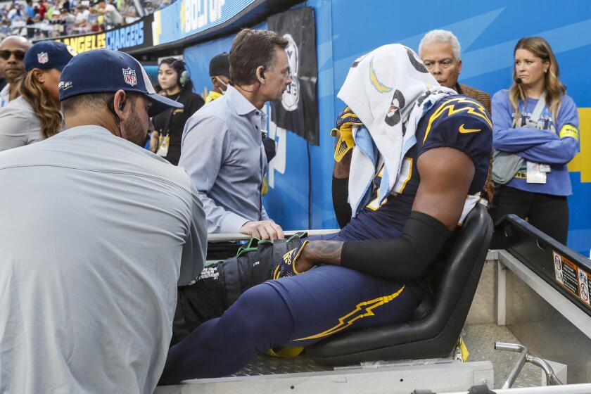 Inglewood, CA, Sunday, October 23, 2022 - Los Angeles Chargers cornerback J.C. Jackson (27) is carted off the field after injuring his knee against the Seattle Seahawks at SoFi Stadium. (Robert Gauthier/Los Angeles Times)