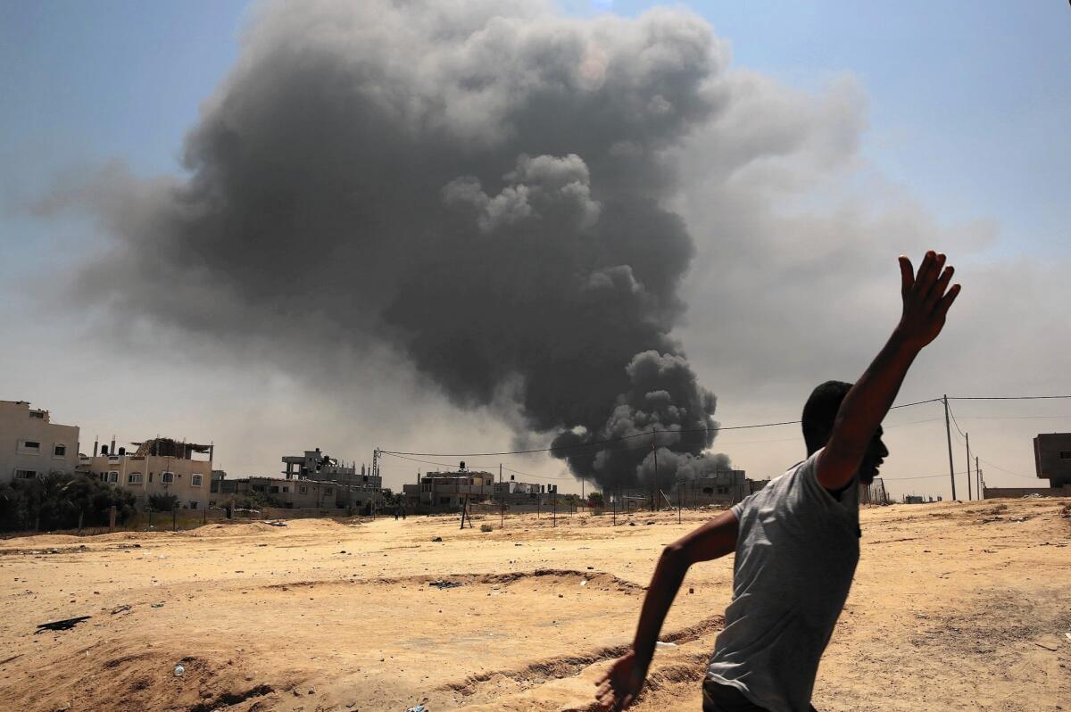 Smoke rises from a power plant in the Gaza Strip after a night of Israeli bombing in July.