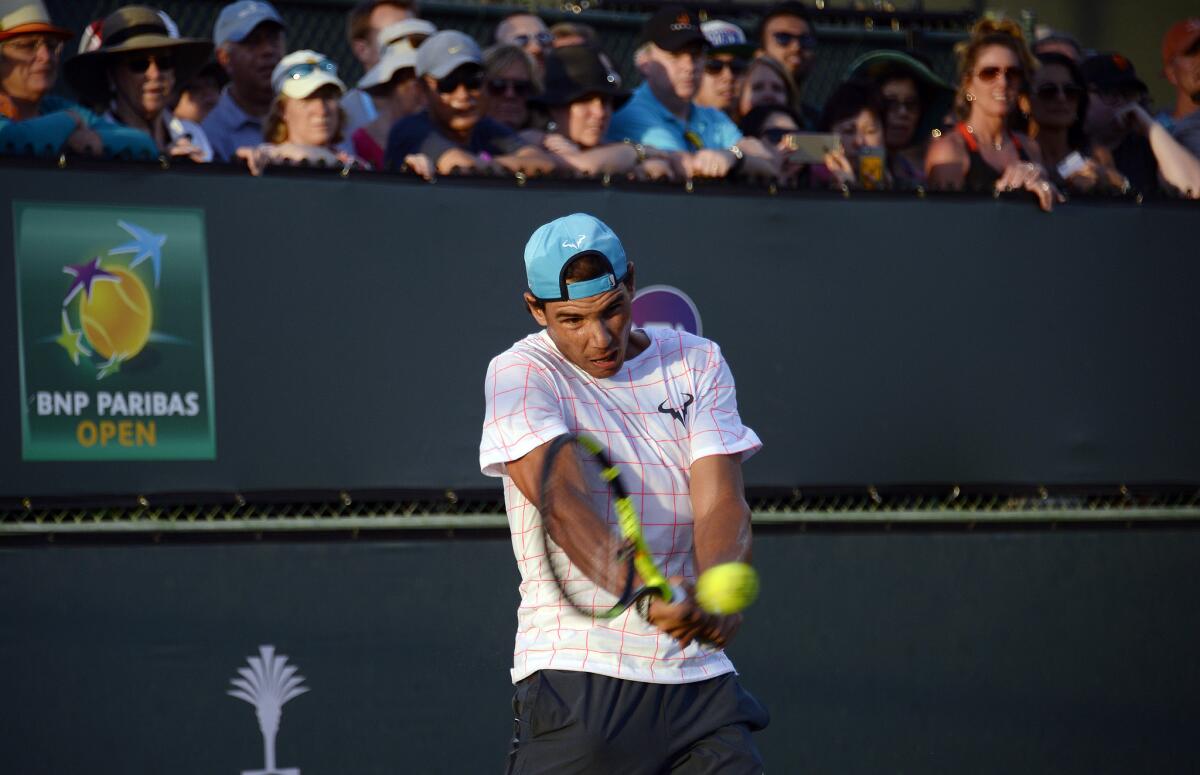 Rafael Nadal practices in front of a large crowd Thursday at Indian Wells.