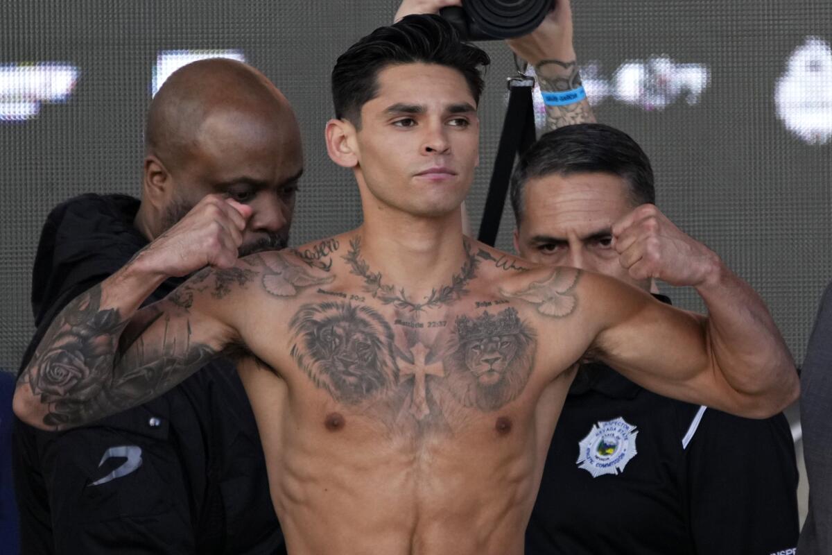 Ryan Garcia poses on the scale during a weigh-i 