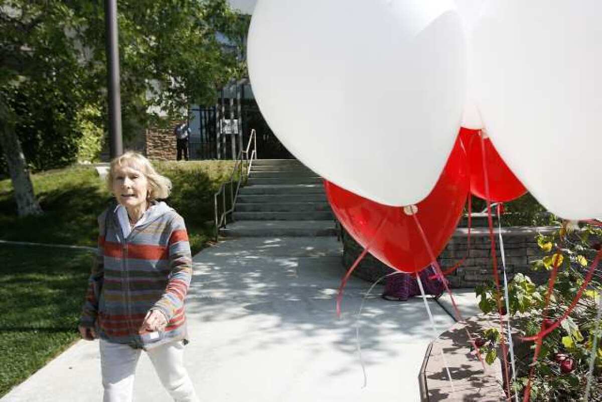 Trish Hall, of Pasadena, leaves after making an appointment to give blood at Sport Chalet Corporate Offices in La Cañada Flintridge. Two Sport Chalet employees were severely burned in an explosion.