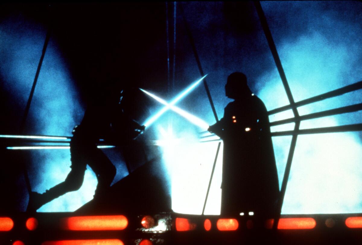 Luke Skywalker (Mark Hamill) and Darth Vader (David Prowse) battling with lightsabers