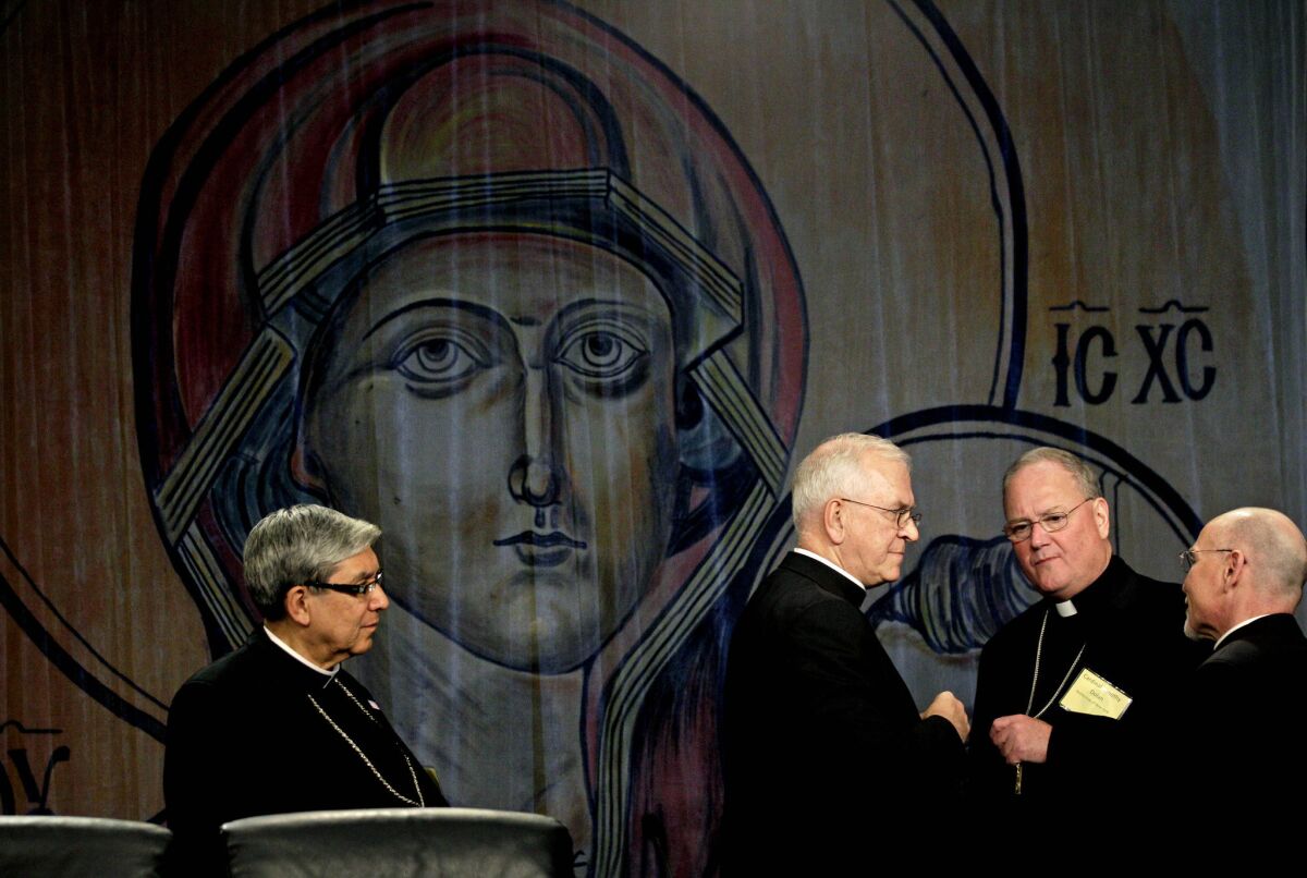 Catholic bishops view same-sex marriage and Obamacare's contraceptive mandate as threats to religious liberty. Above: Bishop Octavio Cisneros of Brooklyn, N.Y., from left, Archbishop Joseph Kurtz of Louisville, Ky., Cardinal Timothy Dolan of New York and Msgr. Ronny Jenkins at a meeting of U.S. bishops in Atlanta.