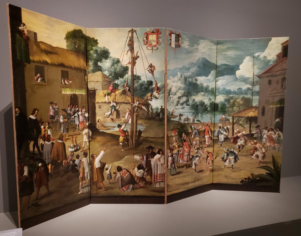 A painted folding screen depicting a wedding.