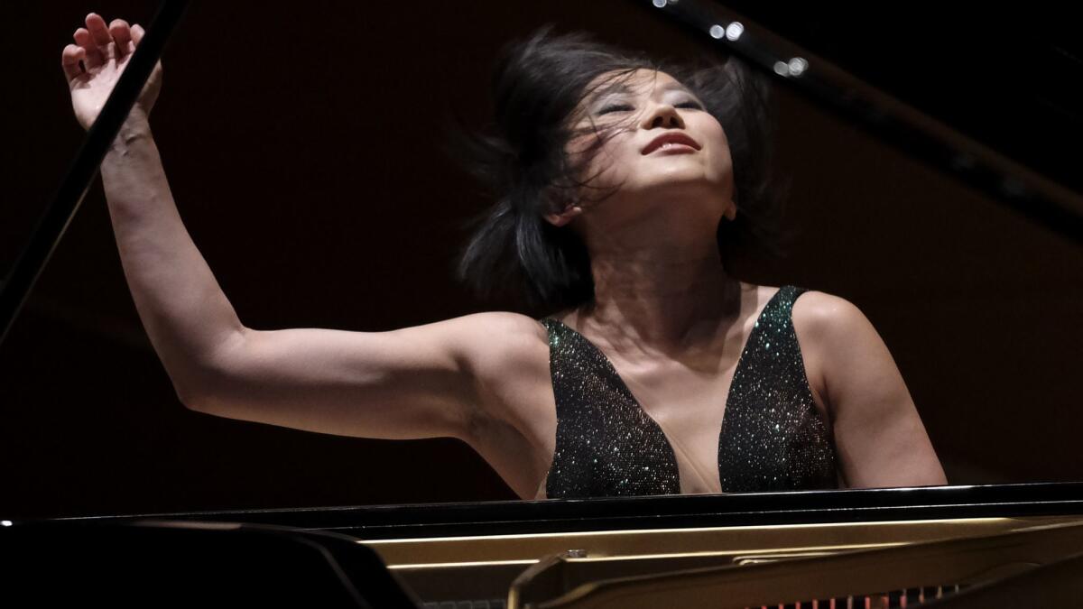 Pianist Yuja Wang returns to Walt Disney Concert Hall to perform a new concerto by John Adams with the Los Angeles Philharmonic.