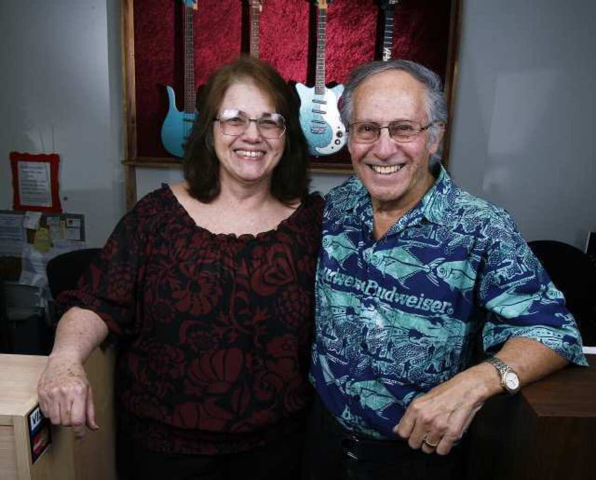Diane and Manny Mora, co-owners with their son Joe of newly remodeled Pedrini Music in La Crescenta.