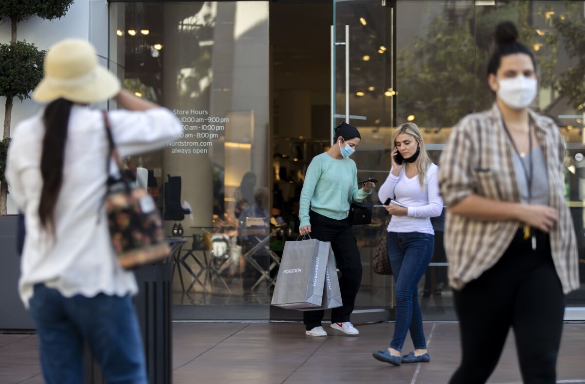 Shoppers exit Nordstrom at the Grove