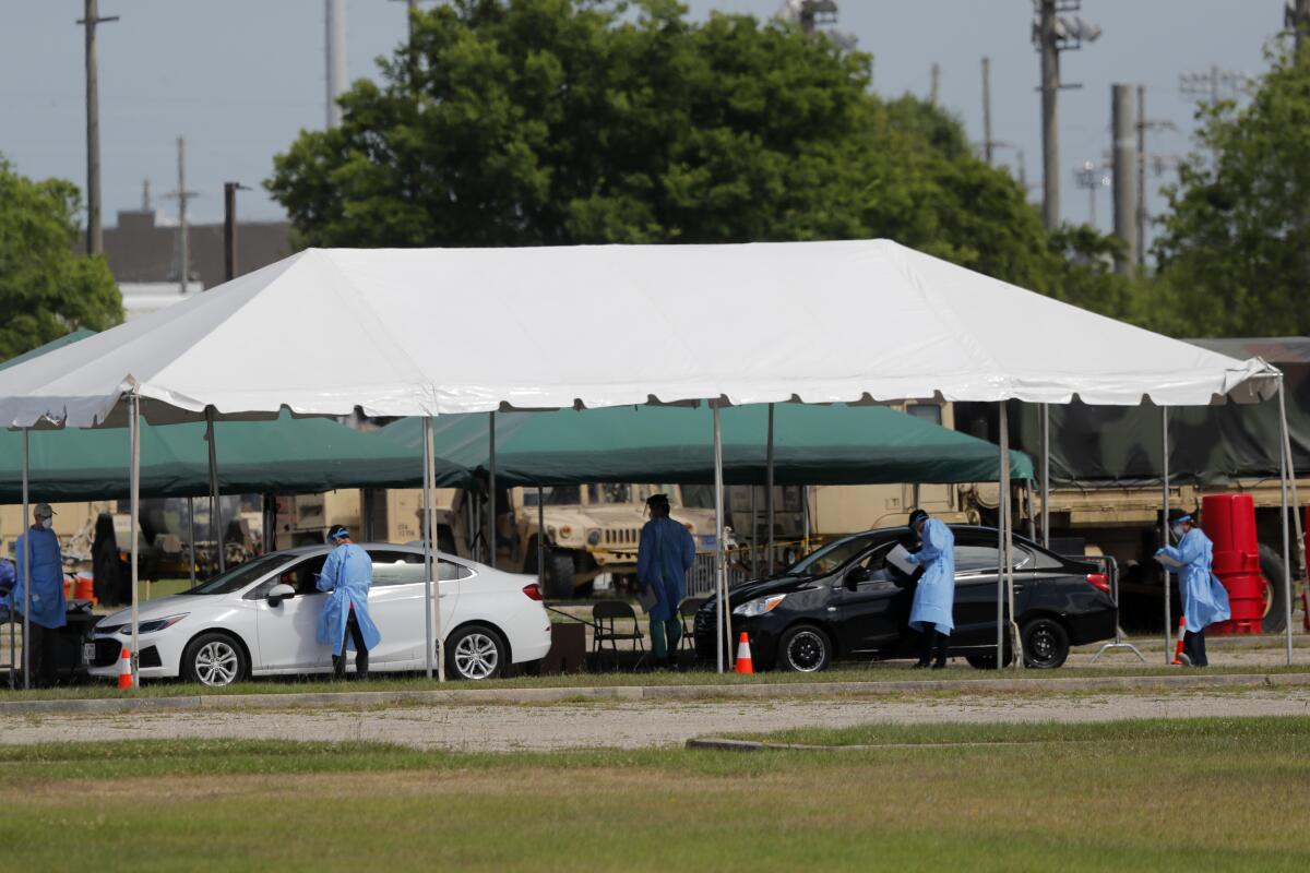 Medical workers screen people in New Orleans