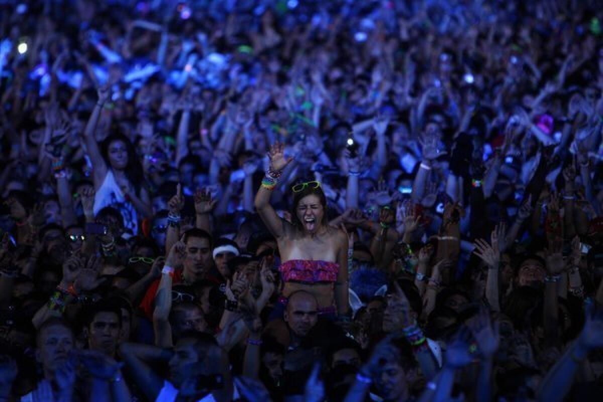 Rave fans dance during a set by DJ David Guetta during the Electric Daisy Carnival at the Las Vegas Motor Speedway in 2011. The EDC is one of the largest electronic music festivals in the world.