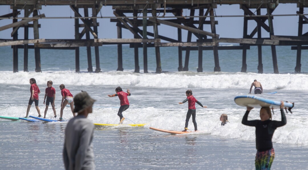 Learning to surf in San Clemente on Tuesday.
