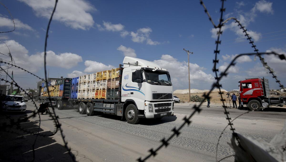 A truck carrying goods to Palestinians arrives at Kerem Shalom crossing in Rafah in the southern Gaza Strip on Aug. 15, 2018. Israel reopened the only commercial crossing into the Gaza Strip in response to relative calm on the border after months of tensions prompted a blockade.