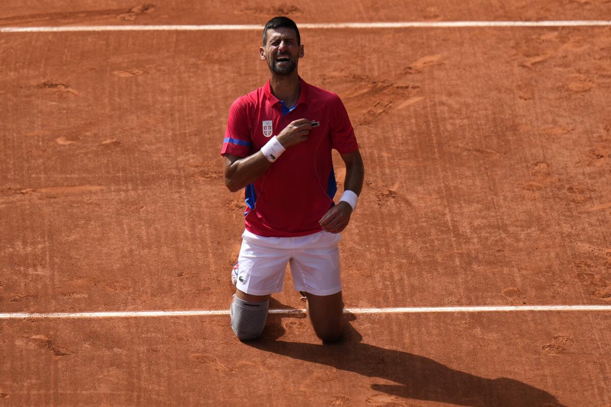 Serbia's Novak Djokovic celebrates after defeating Spain's Carlos Alcaraz for gold.