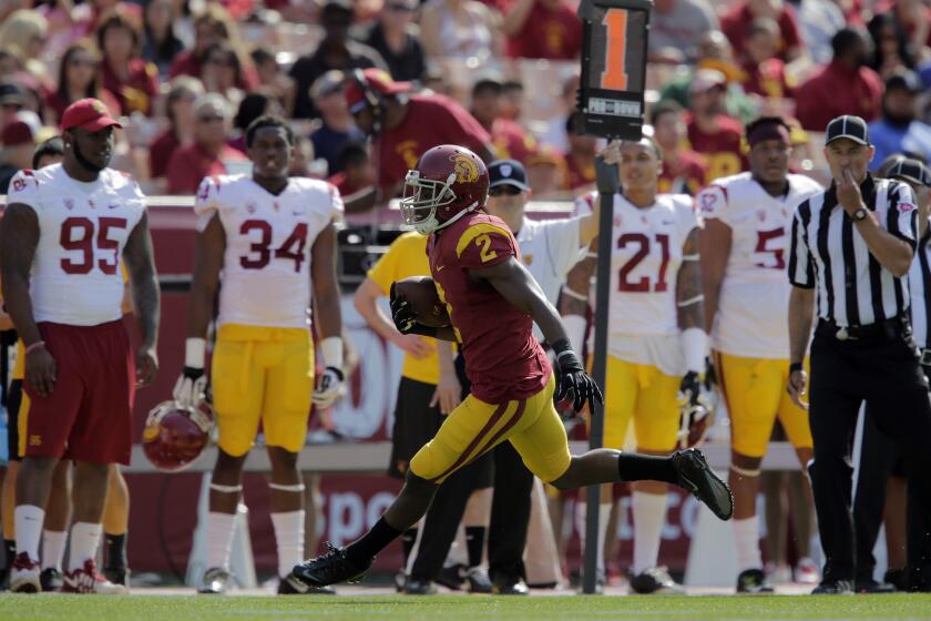 USC's Adoree' Jackson sprints down the sideline during the Trojans' spring game at the Coliseum on April 11.