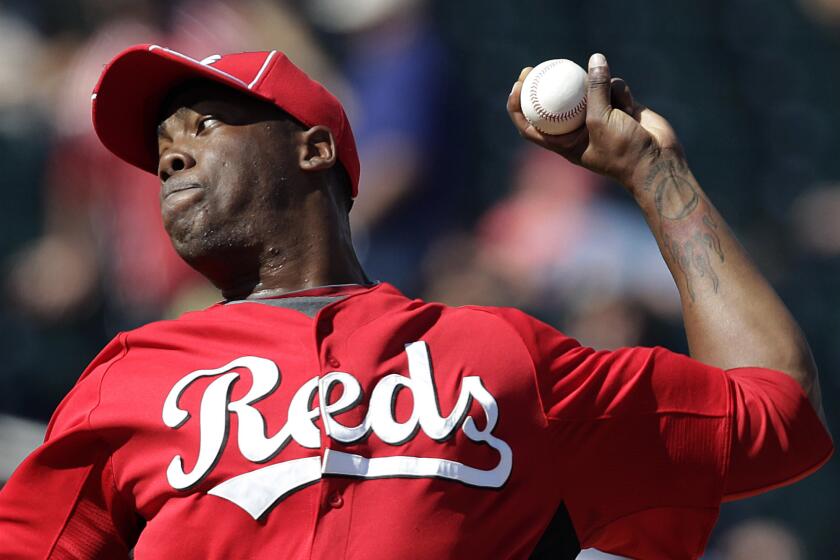 Cincinnati Reds relief pitcher Aroldis Chapman throws against the Cleveland Indians on March 4, 2012.