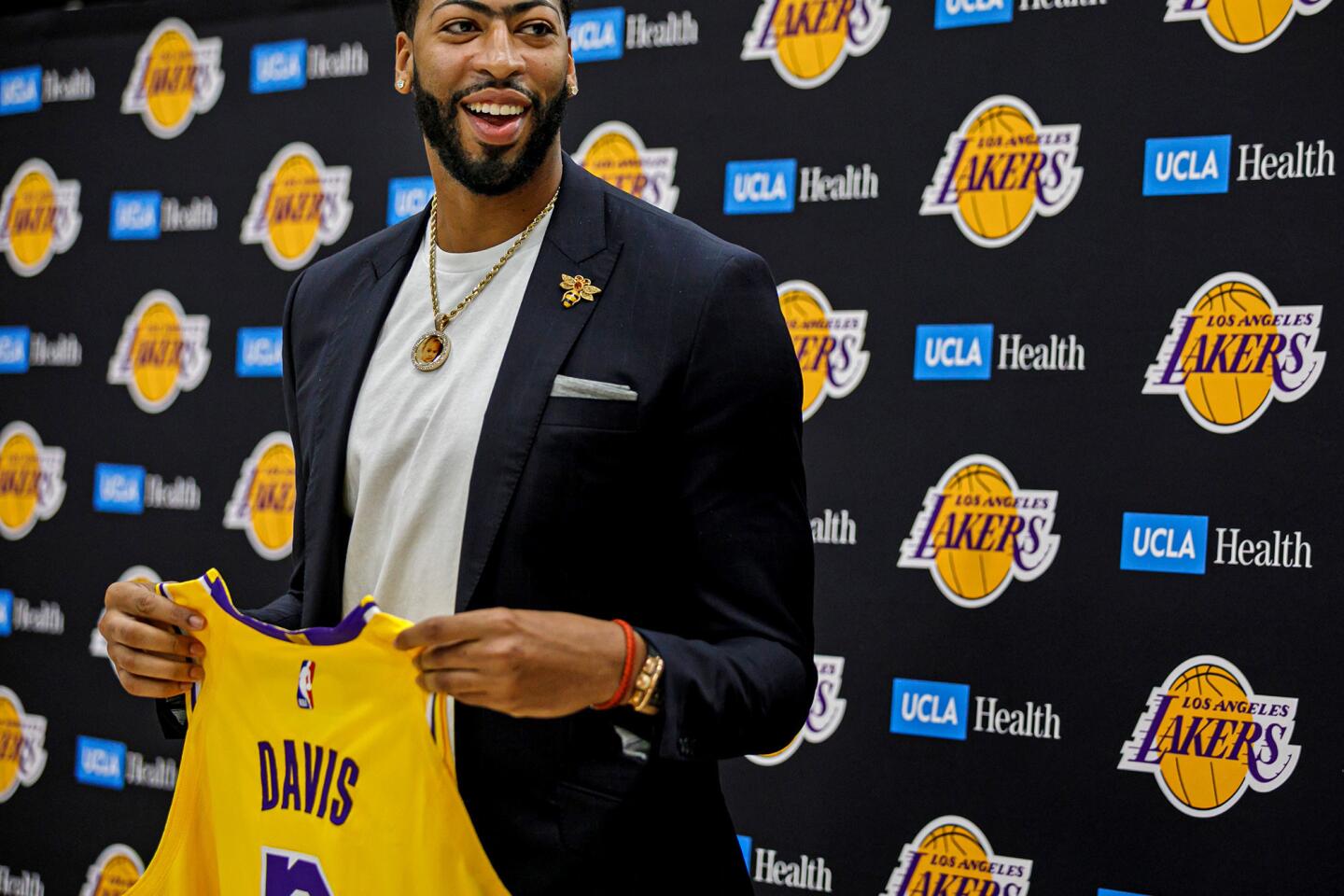Los Angeles, California, USA. 13th July, 2019. Los Angeles Lakers NBA  basketball player Anthony Davis poses with his number 3 jersey as he is  introduced at a news conference at the UCLA