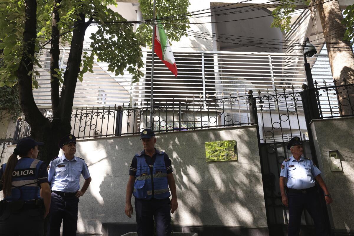 Police guard outside the Iranian Embassy in Tirana, Albania, Thursday, Sept. 8, 2022. The last staff of the Iranian Embassy in Tirana left the building Thursday after they were given 24 hours to leave Albania over a major cyberattack that the Albanian government blames on Iran. (AP Photo/Franc Zhurda)