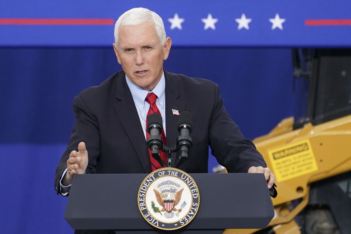 FILE - In this Tuesday, Sept. 1, 2020, file photo, Vice President Mike Pence speaks at a campaign event on the grounds of Kuharchik Construction, Inc., in Exeter, Pa. Labor Day kicks off the unofficial start to fall election campaign. (AP Photo/John Minchillo, File)